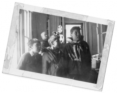 Missionary projecting a movie for Cree children